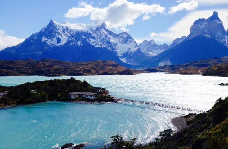 Torres del Paine mountains with a lake in the foreground.