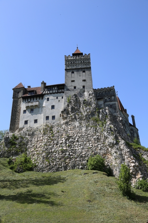       Bran Castle, an iconic fortress on a rocky hill.
  