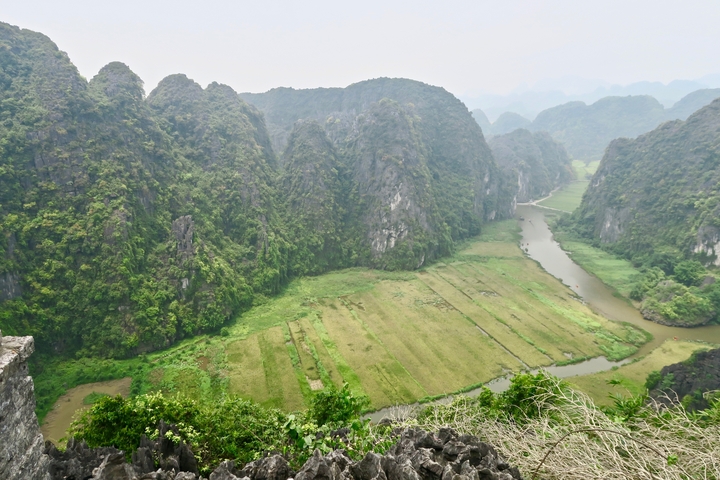 Verdant valley surrounded by steep mountains.