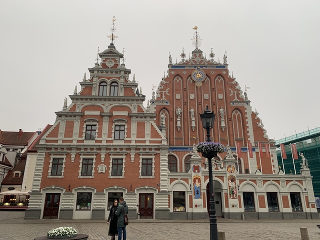 Iconic buildings with ornate facades in a historic square.