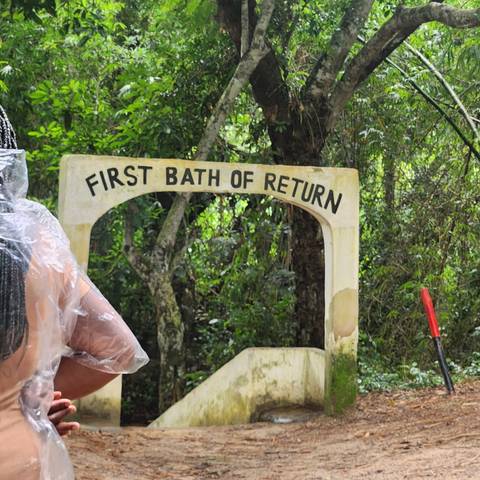       Sign at Assin Manso indicating 'First Bath of Return'.
  