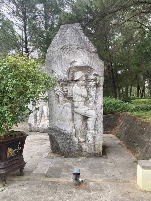       Large stone sculpture with intricate carvings
  