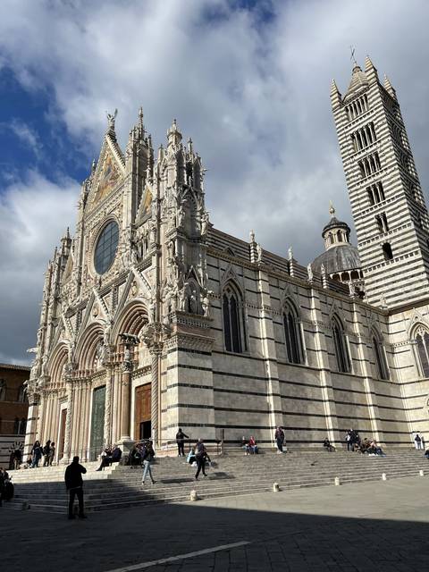 Cathedral facade with people around.