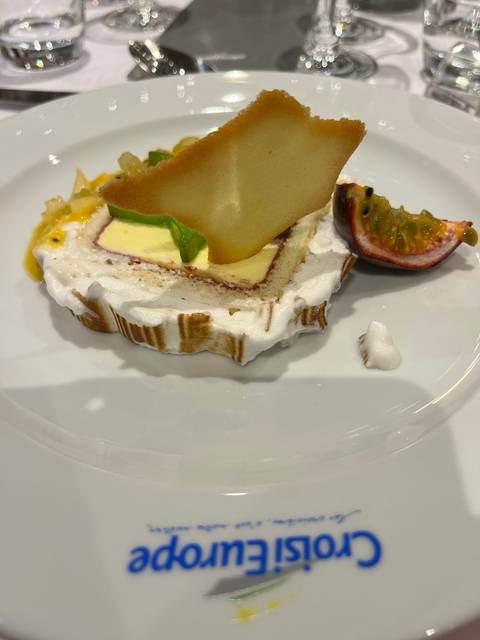 Dessert presentation with branding on plate.