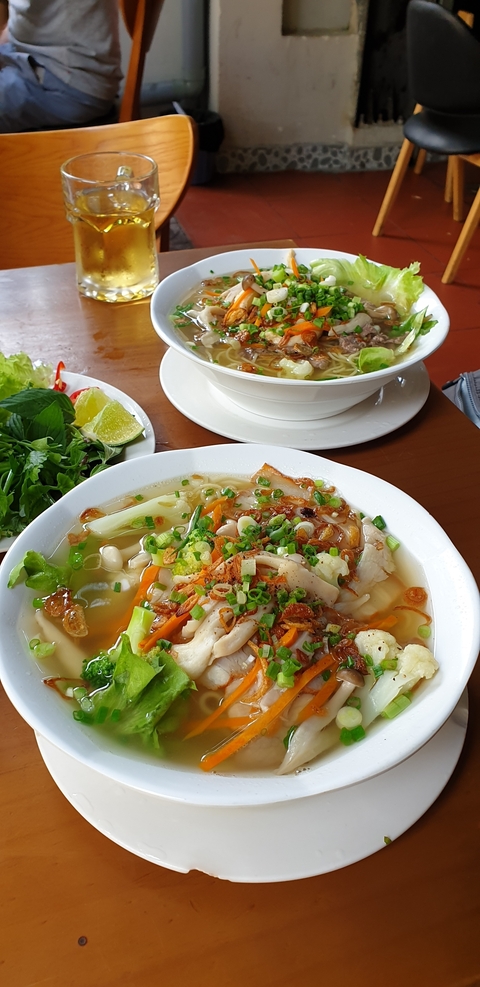 Traditional Vietnamese noodle soup with vegetables.