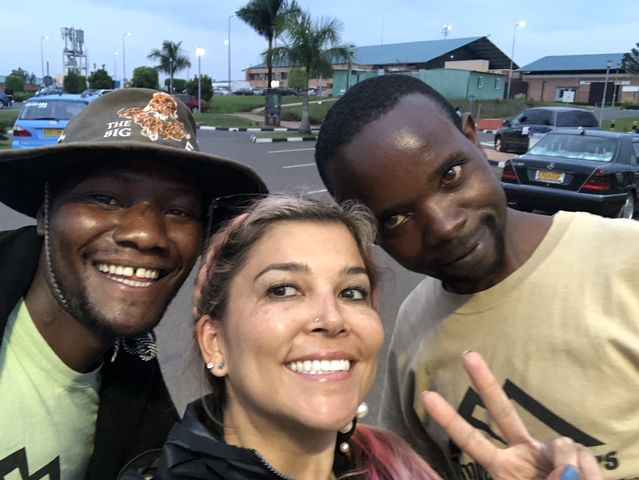 Three people taking a selfie outdoors.