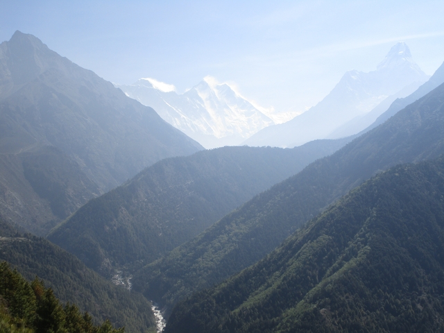 A mountainous landscape with peaks and valleys.