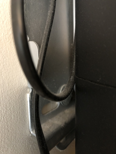 Close-up of an object with a cable.