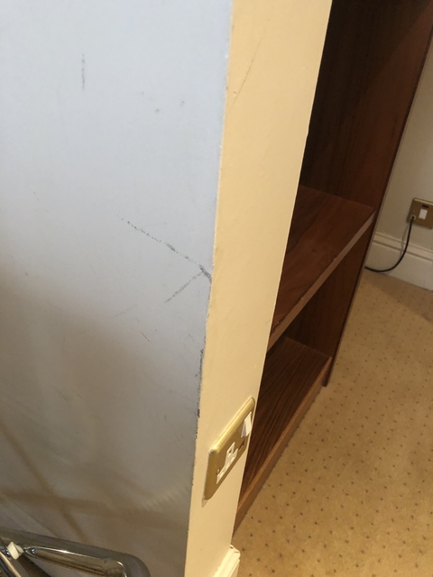 Detail of a scratched wall corner.