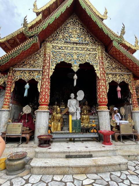 Intricate temple facade decorated with golden patterns.