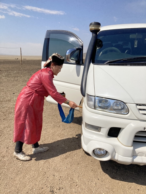       Traditional blessing of a vehicle with milk
  