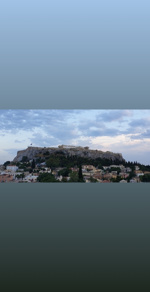 Panoramic view of the Acropolis in Athens on a hilltop overlooking the city.