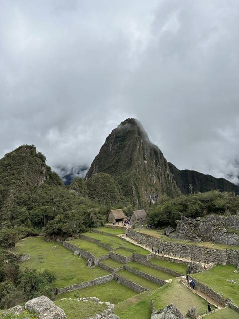 Iconic ruins with a mountain peak in the background.