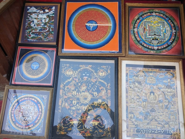       A collection of colorful mandalas and traditional artwork.
  