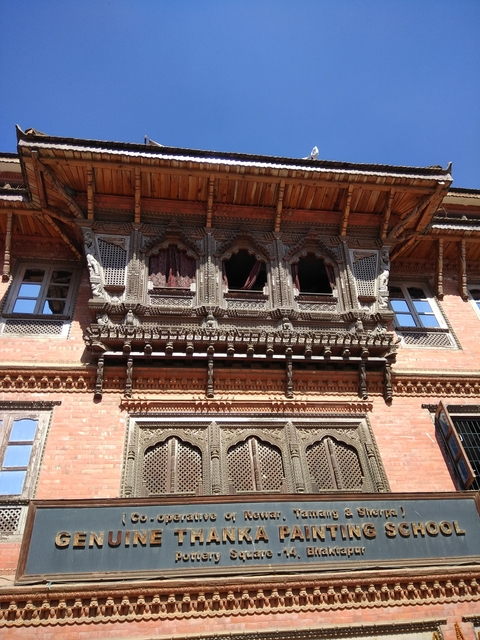       Close-up of an intricately carved wooden facade.
  