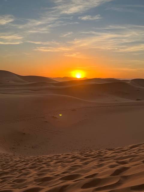 Sunset over sand dunes