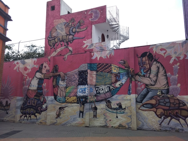 Colorful street art mural on a wall.