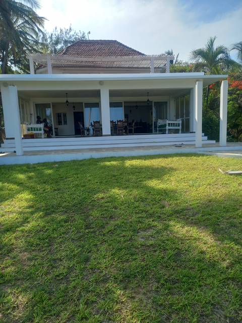       Residential house and green lawn.
  