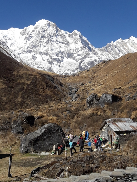 Mountain valley with distant snow-capped peaks.
