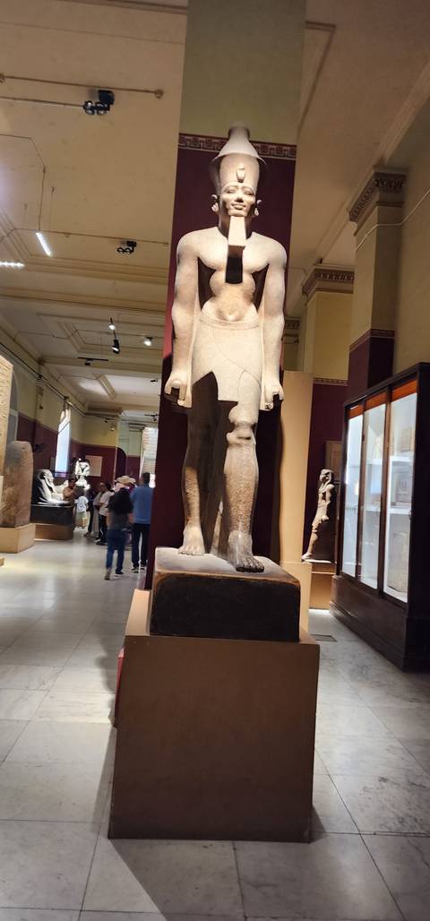 Large statue in a museum setting.