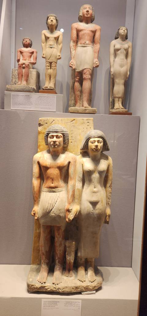 Statues in a museum display.