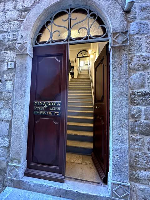 Entrance to a historical building with stone stairs.