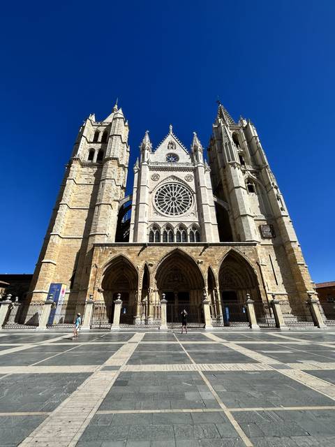       A grand cathedral under a clear blue sky.
  