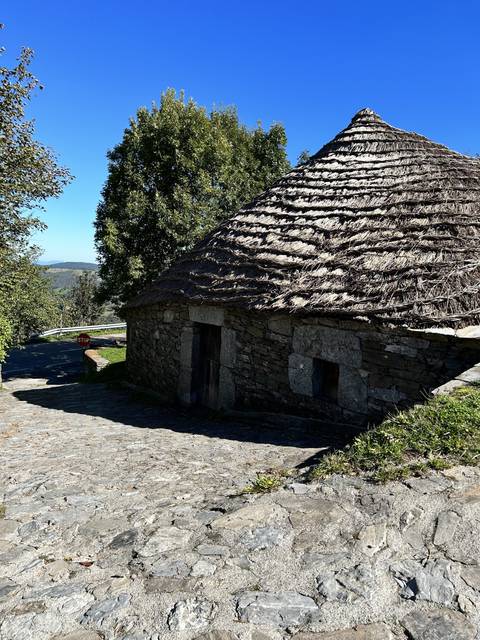 Traditional stone building in a rural setting.