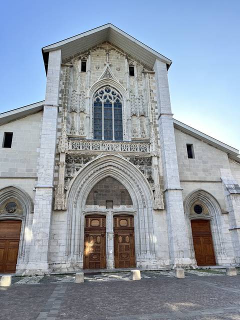       Large historical church facade with intricate designs.
  
