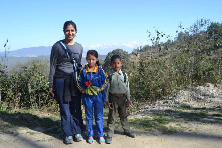 Woman with children in a mountainous landscape