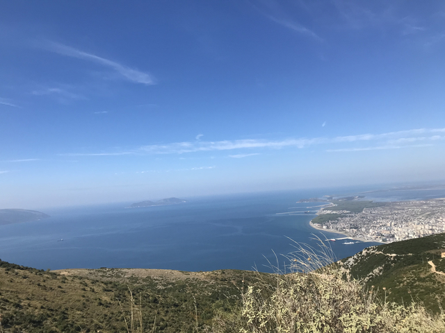 Coastal landscape with islands and a sprawling ocean view.