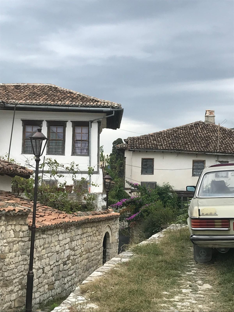 Traditional buildings with tiled roofs in an Albanian town.