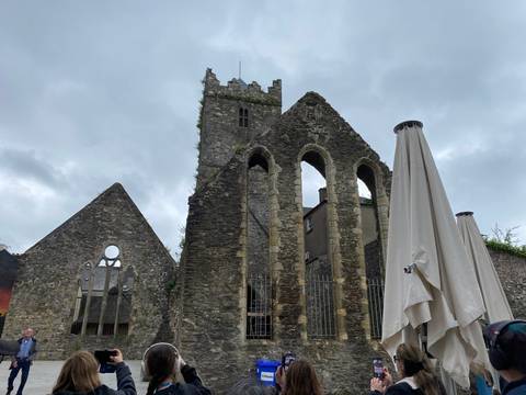 Historic stone castle with umbrellas in view