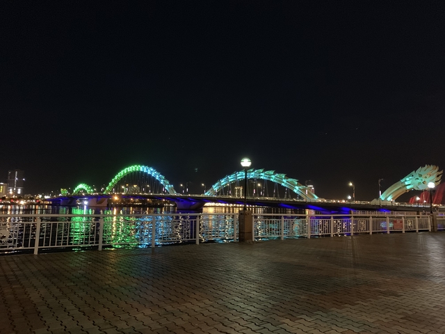 Dragon Bridge in Da Nang illuminated at night.