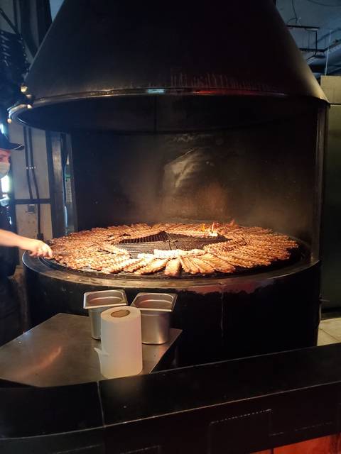 Grilled food on a circular grill.