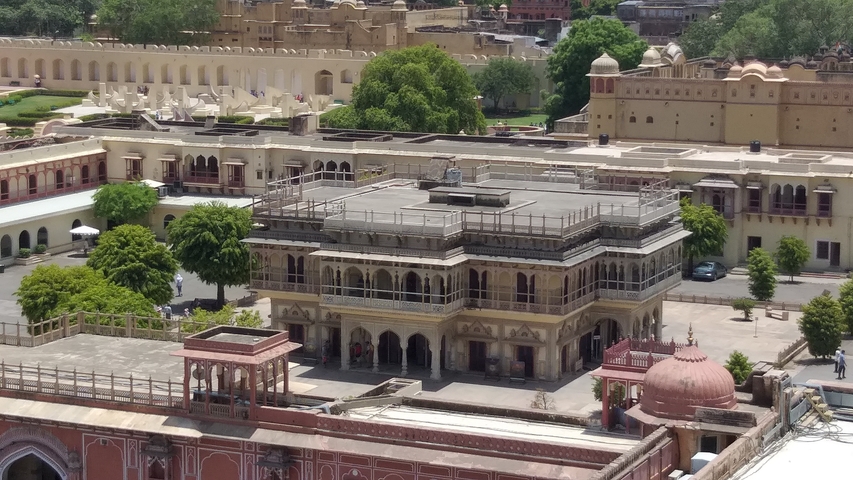       Aerial view of historic architecture with courtyards and greenery.
  