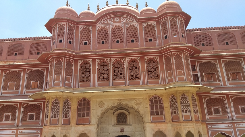       Close-up of a palace featuring intricate red and white designs.
  