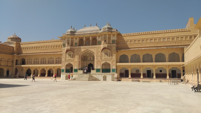       Courtyard of a historic fort with detailed arches
  
