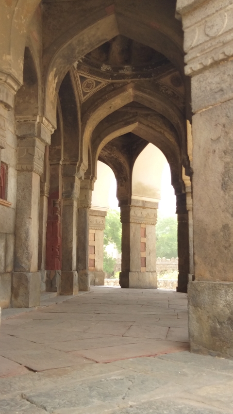       Stone arches with sunlight streaming through
  