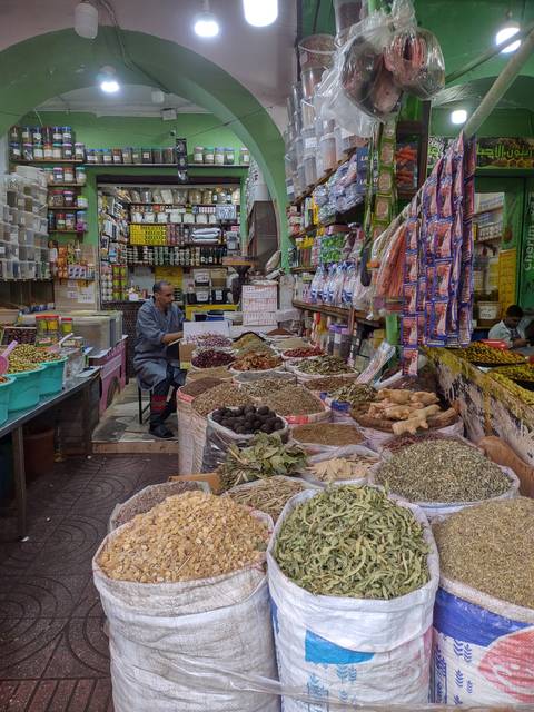 Market stall selling a variety of spices and herbs.