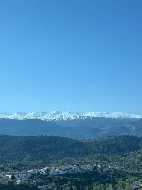       Mountain range with snow-covered peaks.
  