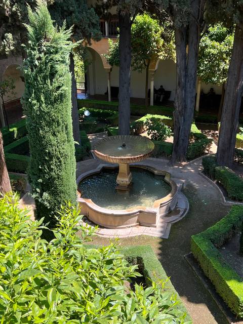 Decorative fountain in a well-manicured garden.