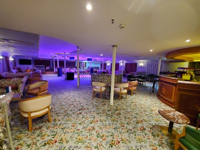 Modern lounge area with lighting and seating.