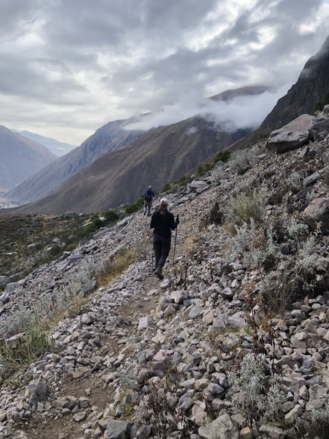 Hikers on a rocky mountain trail