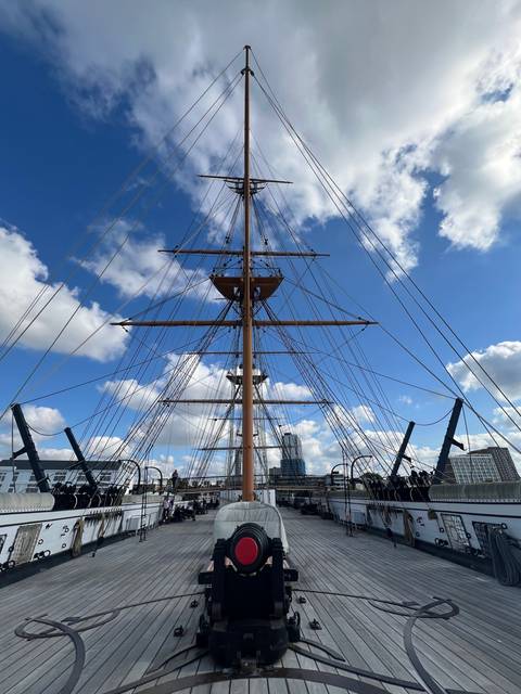       A tall ship with masts and rigging.
  