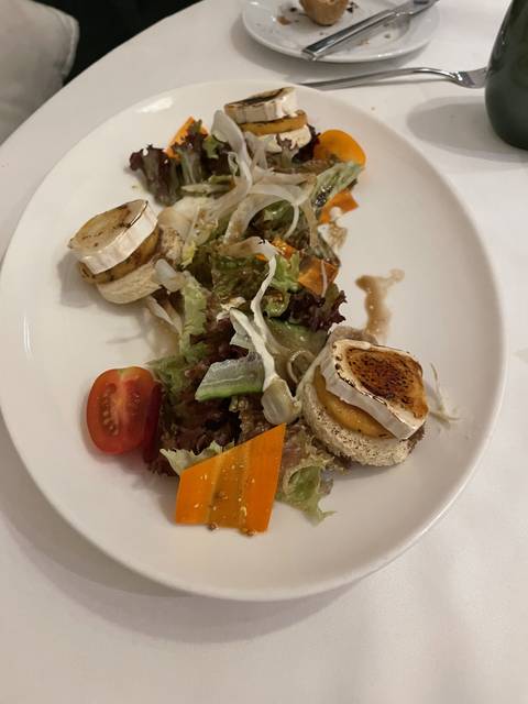 Plate of gourmet salad with colorful vegetables