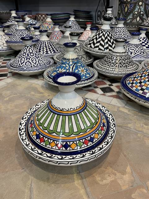       Colorful Moroccan pottery on display.
  