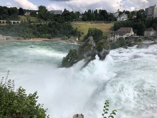 Powerful waterfall cascading down rocky cliffs.