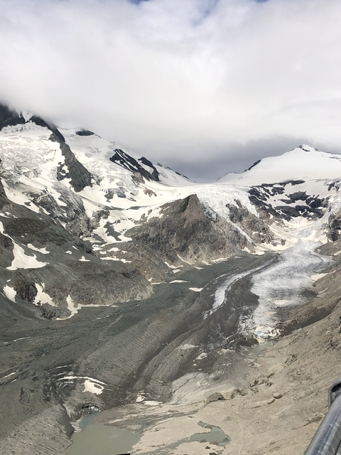       Snowy mountain range with a glacier.
  