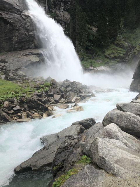 Rushing waterfall with rocks and white water.